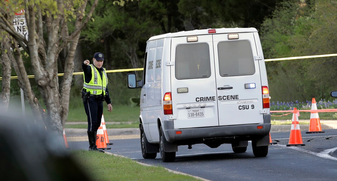 A police crime scene van arrives near the site of Sunday's deadly explosion, Monday, March 19, 2018, in Austin, Texas. Police warned nearby residents to remain indoors overnight as investigators looked for possible links to other package bombings elsewhere in the city this month. (AP Photo/Eric Gay)