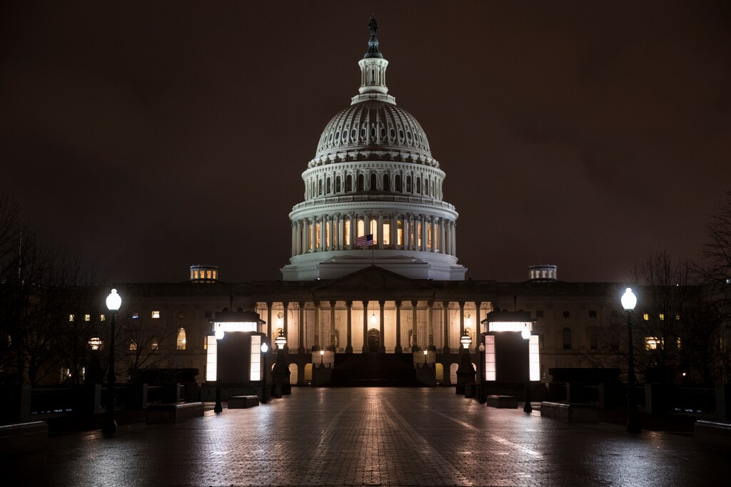 (J. Scott Applewhite | The Associated Press) The Capitol is seen before dawn Wednesday after a night of negotiating on the government spending bill, in Washington, March 21, 2018. Talks over a $1.3 trillion omnibus bill are almost complete as the White House and Capitol Hill Democrats ironed out deals on a first round of funding for President Donald Trump's U.S.-Mexico border wall.