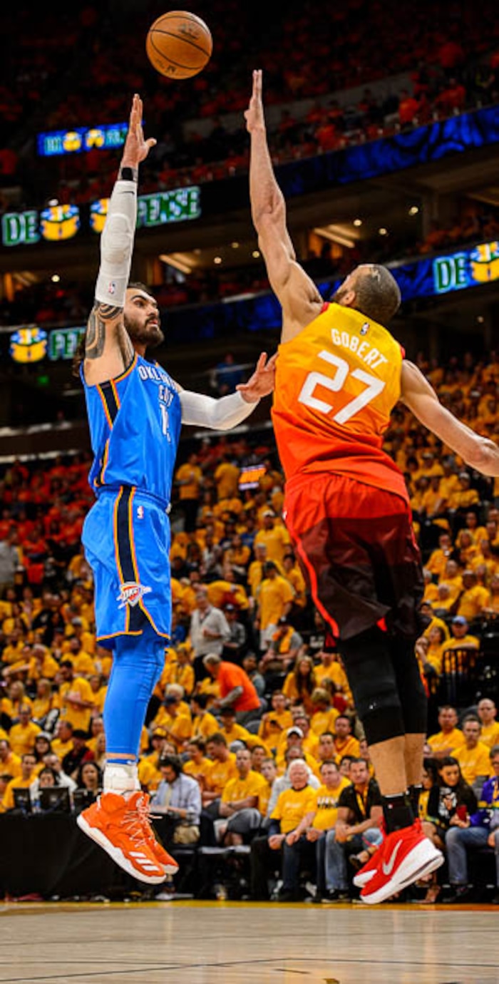 (Trent Nelson | The Salt Lake Tribune)  
Utah Jazz host the Oklahoma City Thunder, Game 3, NBA playoff basketball in Salt Lake City, Saturday April 21, 2018. Oklahoma City Thunder center Steven Adams (12) shoots over Utah Jazz center Rudy Gobert (27).