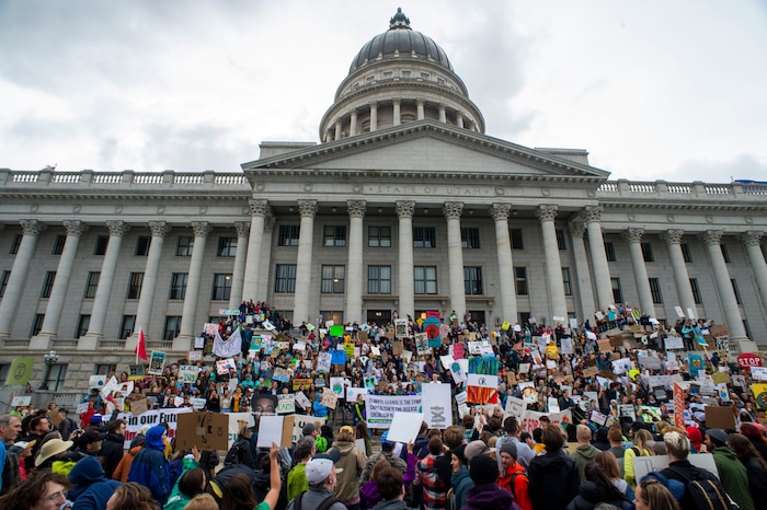 (Rick Egan  |  The Salt Lake Tribune)      
Ocea Wraye joins hundreds of students from around the state chant and sing at the Utah State Capitol Building, demanding action on the climate crisis. Friday, Sept. 20, 2019.