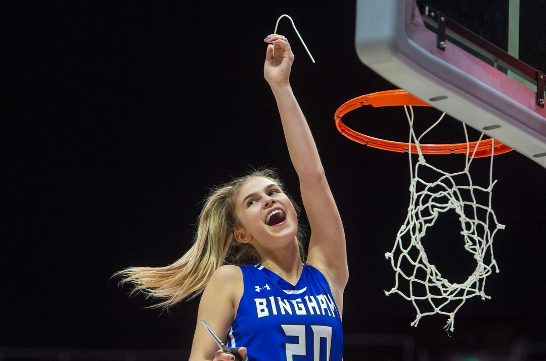 The Salt Lake Tribune)   Bingham Miners Sierra Lichtie (20)  cuts off a piece of the net, as the Bingham Miners celebrate their 59-51 win over the Fremont Silverwolves, in the 6A championship game, at the Jon M. Huntsman Center, Saturday Feb. 29, 2020