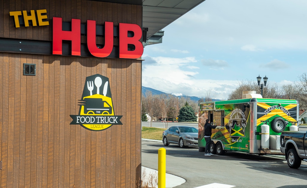 (Rick Egan  |  The Salt Lake Tribune)     Customers order from Jamaica's Kitchen Food Truck at the The Hub Food Truck Park in South Jordan, Wednesday, March 25, 2020.