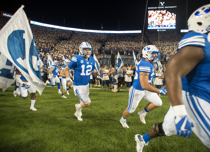 (Rick Egan  |  The Salt Lake Tribune)   Brigham Young Cougars quarterback Tanner Mangum (12) takes the field before  football action BYU vs Utah, at Lavell Edwards Stadium in Provo, Saturday, September 9, 2017.