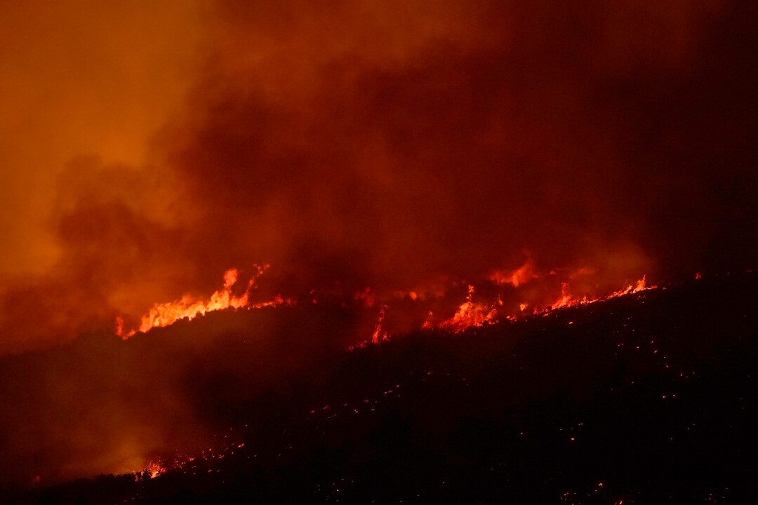 (George Frey  |  for The Salt Lake Tribune) A wildfire burns on Traverse Mountain above Lehi, Uta,h on June 28th, 2020.