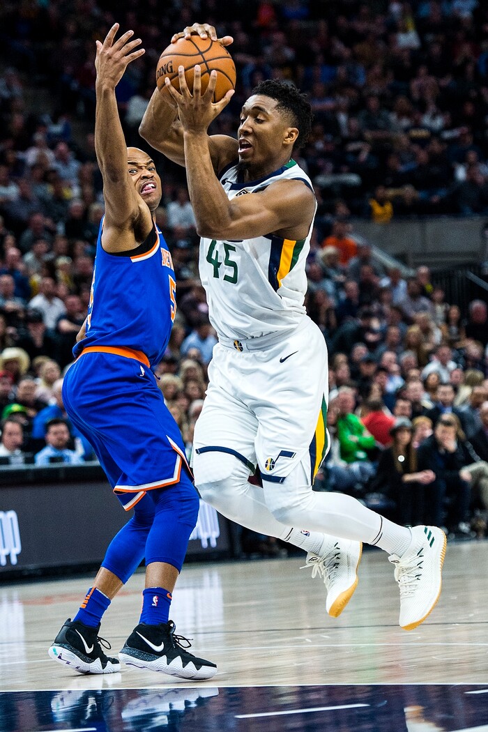 (Chris Detrick  |  The Salt Lake Tribune)  Utah Jazz guard Donovan Mitchell (45) runs past New York Knicks guard Jarrett Jack (55) during the game at Vivint Smart Home Arena Friday, January 19, 2018.  