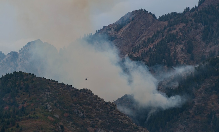 (Francisco Kjolseth  |  The Salt Lake Tribune) Crews battle a fire in Neffs Canyon on the north side of Mount Olympus on Tuesday, Sept, 22, 2020, that started the night before.