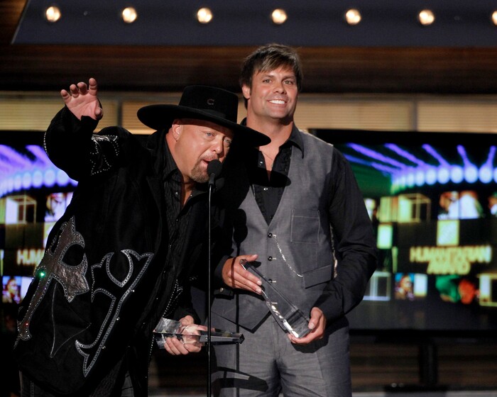 Eddie Montgomery, left, and Troy Gentry, of Montgomery Gentry, accept the HOme Depot Humanitarian award at the 45th Annual Academy of Country Music Awards in Las Vegas on Sunday, April 18, 2010. (AP Photo/Matt Sayles)