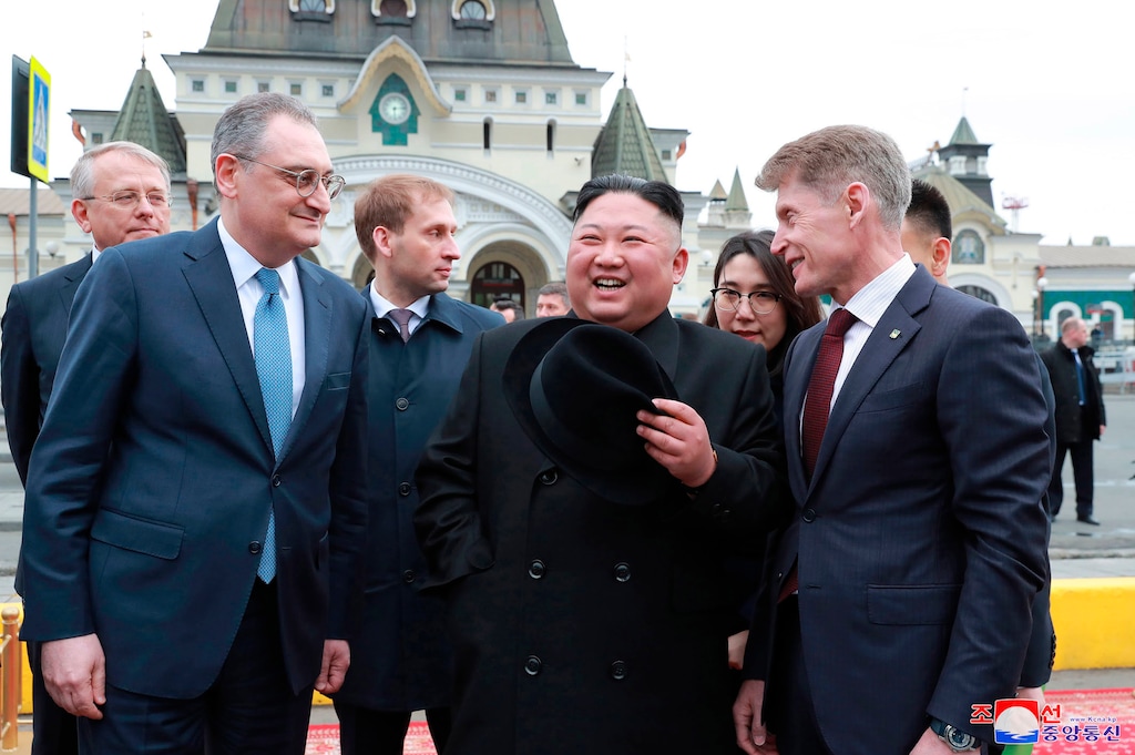 (Korea News Service via AP | Korean Central News Agency) In this Wednesday, April 24, 2019, photo, North Korean leader Kim Jong Un, center, is welcomed by Russian officials on his arrival in Vladivostok, Russia. The content of this image is as provided and cannot be independently verified. Korean language watermark on image as provided by source reads: "KCNA" which is the abbreviation for Korean Central News Agency.