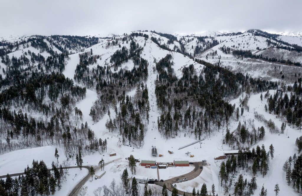 (Francisco Kjolseth | The Salt Lake Tribune) Ski lifts climb the mountain above the hamlet of Peterson in Morgan County, pictured Wednesday, Dec. 13, 2023, where the exclusive community and private ski resort of Wasatch Peak Ranch has been under development.