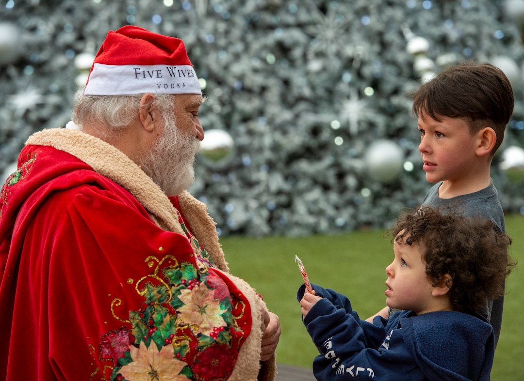 (Rick Egan  |  The Salt Lake Tribune)       Joel Bradford gives some candy to Zenobia Ruiz, 3, and Vincent Ruiz, 6,  during the second annual Made in Utah Winter Fest at The Gateway.  The free festival includes local artists, musicians, artisans, breweries, distilleries, food trucks, and other local businesses, to help promote shopping locally for holidays. The Utah Winter Fest continues December 21 & 22. Sunday, Dec. 15, 2019.
