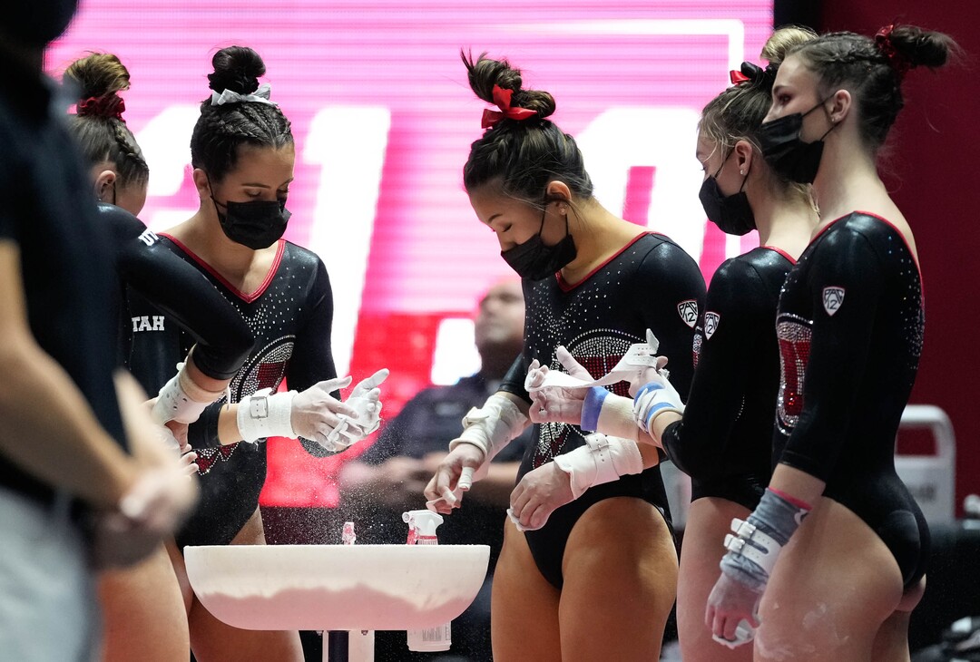 (Francisco Kjolseth | The Salt Lake Tribune) Utah chalks up before competing on the bars during their gymnastics meet with Stanford at the Huntsman Center in Salt Lake City, Saturday, Jan. 29, 2022.