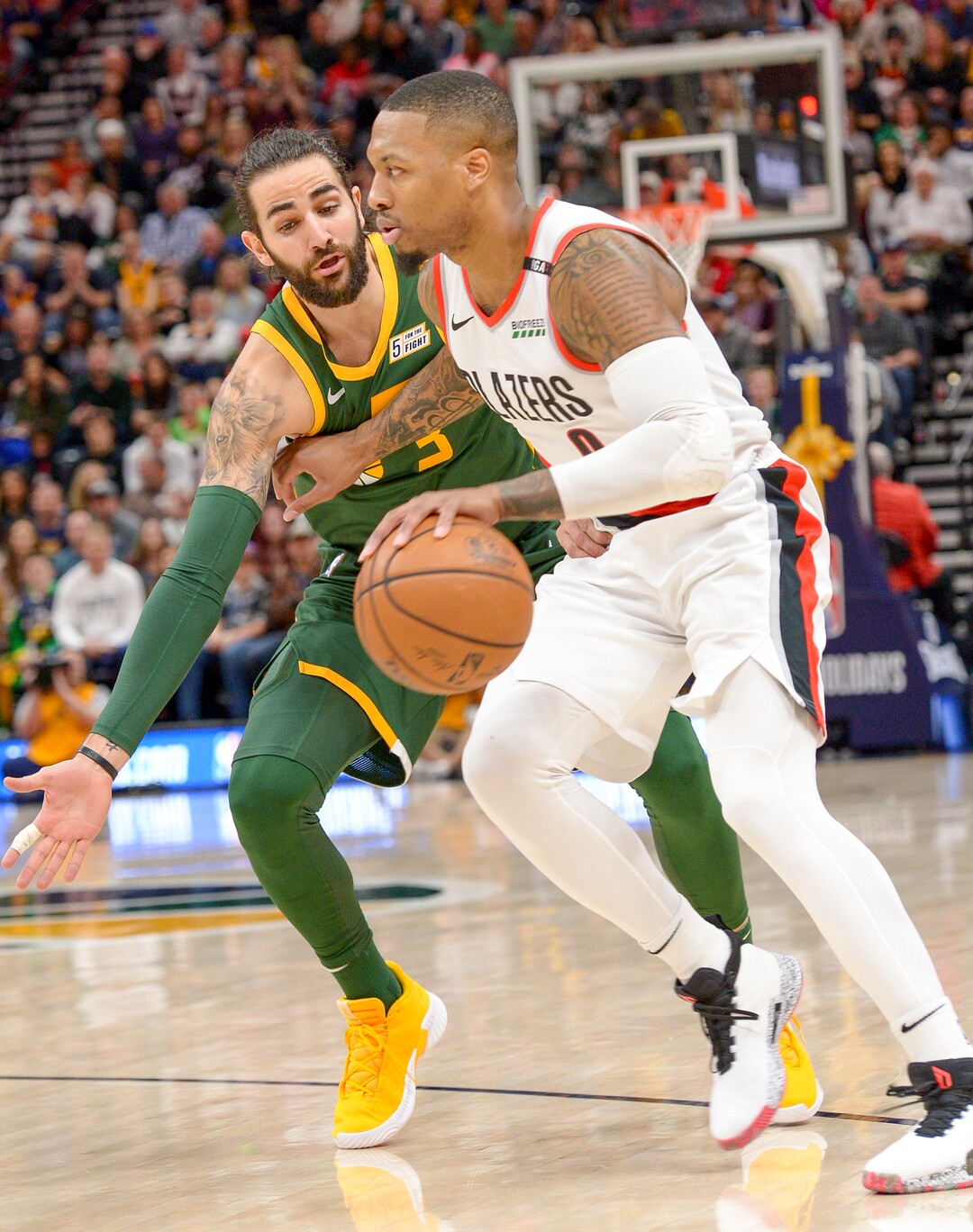 Leah Hogsten  |  The Salt Lake Tribune  Utah Jazz guard Ricky Rubio (3) pressures Portland Trail Blazers guard Damian Lillard (0)as the Utah Jazz host the Portland Trail Blazers Christmas night at Vivint Smart Home Arena.