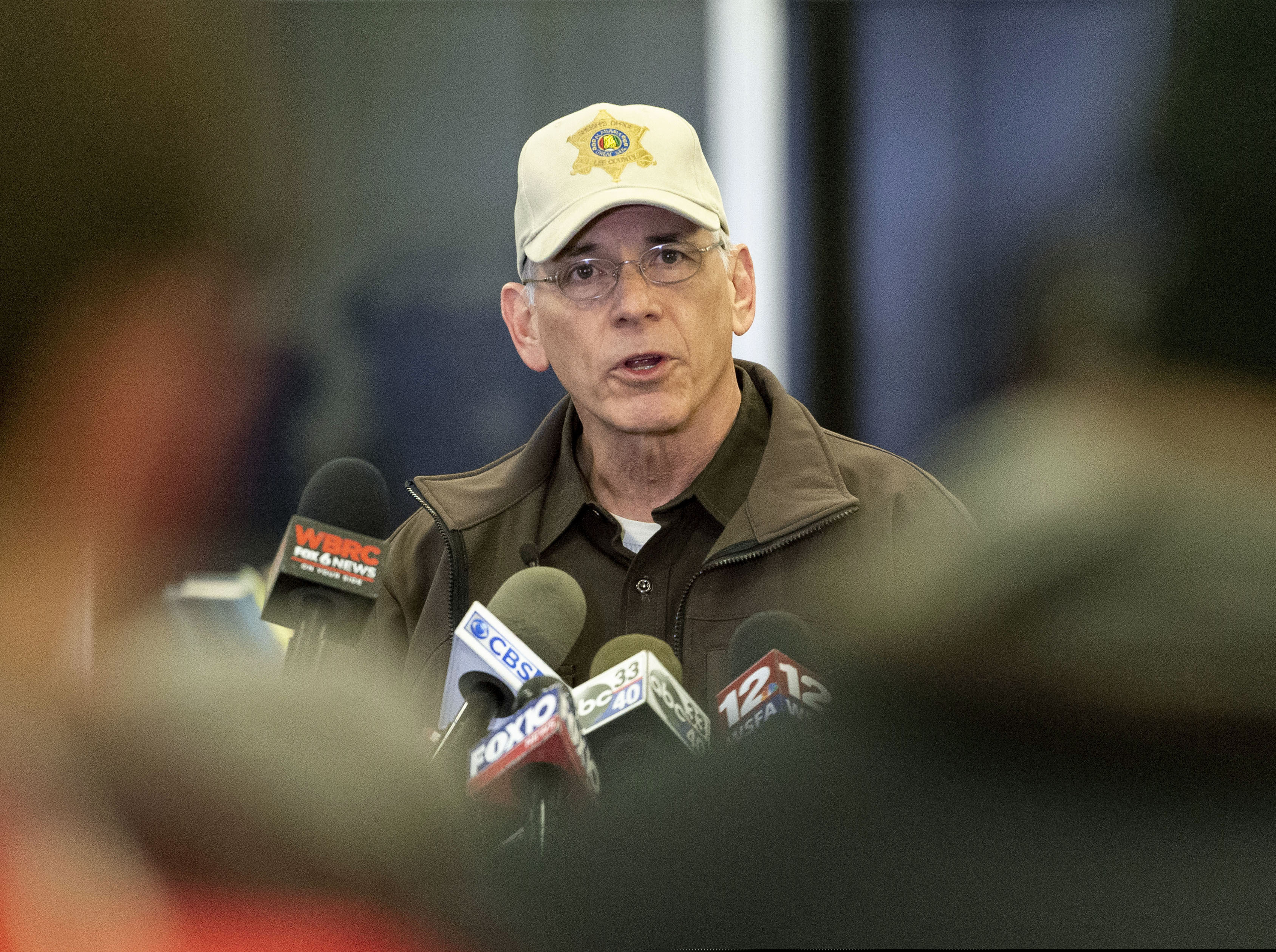 Lee County Sheriff Jay Jones updates the media on search and rescue efforts following Sunday's tornado during a press conference at Beauregard High School, Monday, March 4, 2019, in Beauregard, Ala. Rescuers prepared Monday to tear through the rubble of mobile homes and houses in search of survivors of a powerful tornado that rampaged through southeast Alabama, killing over a dozen people. (AP Photo/Vasha Hunt)
