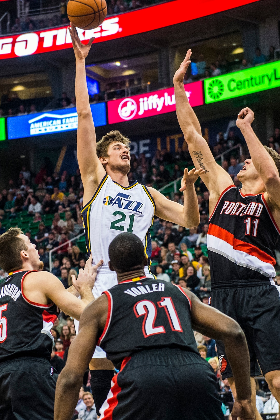 (Chris Detrick | Tribune file photo) Utah Jazz center Tibor Pleiss (21) shoots over Portland Trail Blazers guard Pat Connaughton, (5) forward Noah Vonleh (21) and forward Meyers Leonard (11) during the game at Vivint Smart Home Arena Thursday, Dec. 31, 2015.