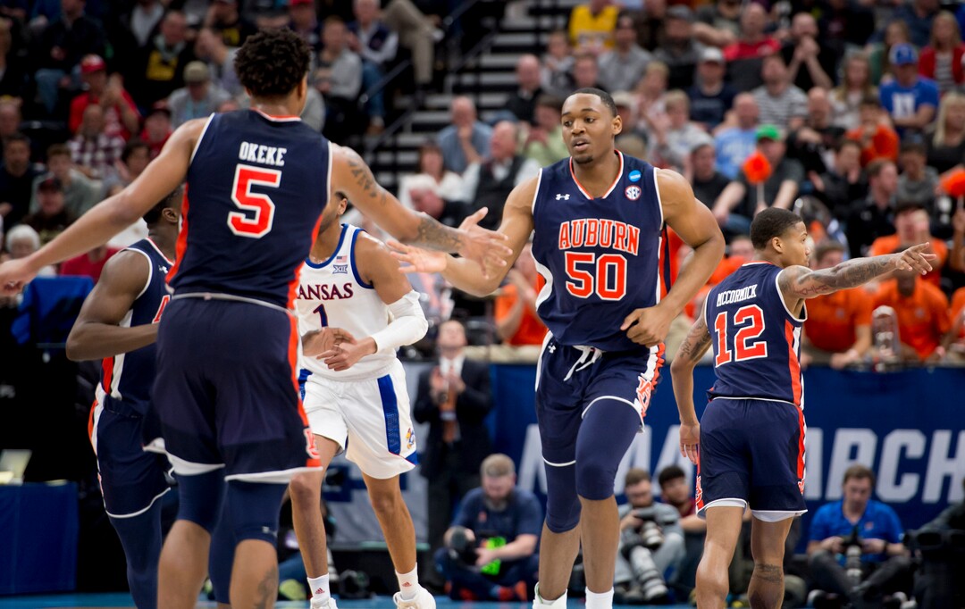 (Leah Hogsten  | The Salt Lake Tribune)  Auburn Tigers center Austin Wiley (50) celebrates with his team as Auburn faces Kansas in the second round of the NCAA tournament in Salt Lake City on Saturday, March 23, 2019.