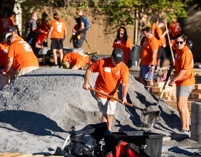 (Rick Egan | The Salt Lake Tribune) More than 600 volunteers, led by Home Depot employees, help spruce up the Sunrise Metro and Freedom Landing apartments in Salt Lake City on Wednesday, Sept. 21, 2022.