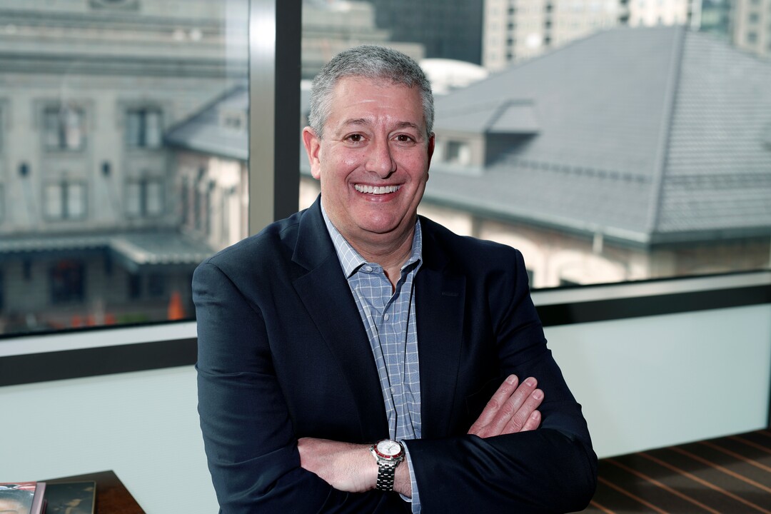 In this Jan. 31, 2018, photo, Rob Cohen, who is spearheading Colorado's effort to secure an Olympic bid, poses in his office in lower downtown Denver. Over 40 years after becoming the first city to walk away from an Olympic bid, Denver is considering whether to try to again to host the Winter Games. (AP Photo/David Zalubowski)