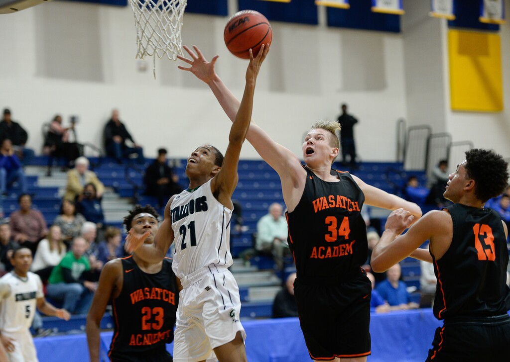(Francisco Kjolseth | The Salt Lake Tribune) Xavian Myles of South County high tries for a basket at Jaxon Kohler of Wasatch Academy puts on the pressure as the two teams compete during a recent tournament in Orem. Wasatch Academy is ranked No. 2 by MaxPreps. The Tigers have joined an elite, national prep basketball league called National Interscholastic Basketball Conference.