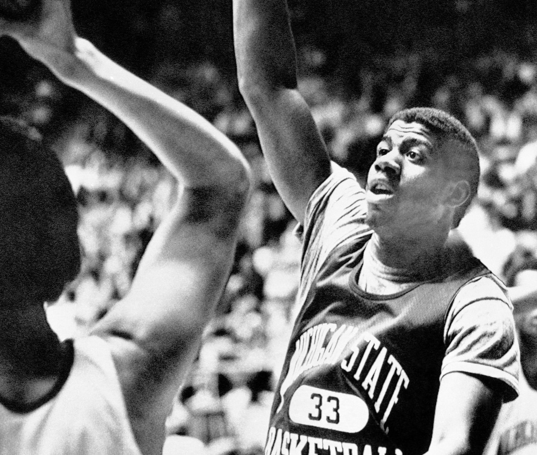 (AP Photo) Michigan State's Earvin Johnson works on his defense as the Spartans worked out in Salt Lake City, Utah on March 23, 1979, in preparation for tomorrow's game with Pennsylvania in the semi-finals of the NCAA tournament. 