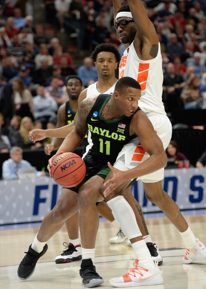 (Francisco Kjolseth  |  The Salt Lake Tribune)  Baylor Bears guard Mark Vital (11) tries to push past Syracuse Orange center Paschal Chukwu (13) as Syracuse faces Baylor in their first round menÕs NCAA March Madness tournament game at Vivint Smart Home Arena in Salt Lake City on Thursday, March 21, 2019.