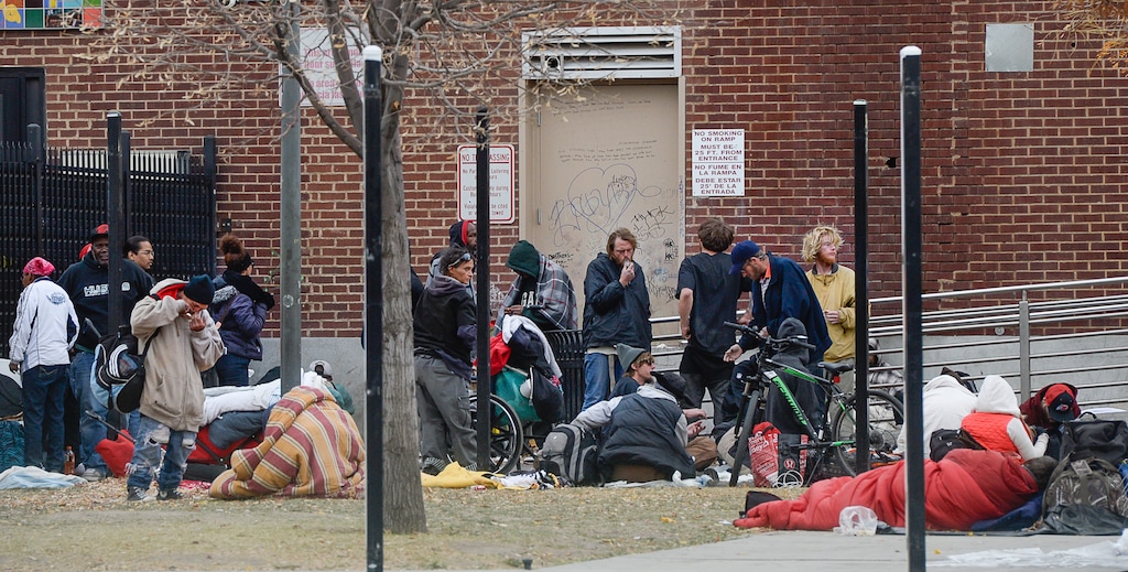 (Francisco Kjolseth  |  The Salt Lake Tribune)  Homeless people gather outside the Road Home Shelter along 500 W. in Salt Lake on Friday, Nov. 3, 2017.