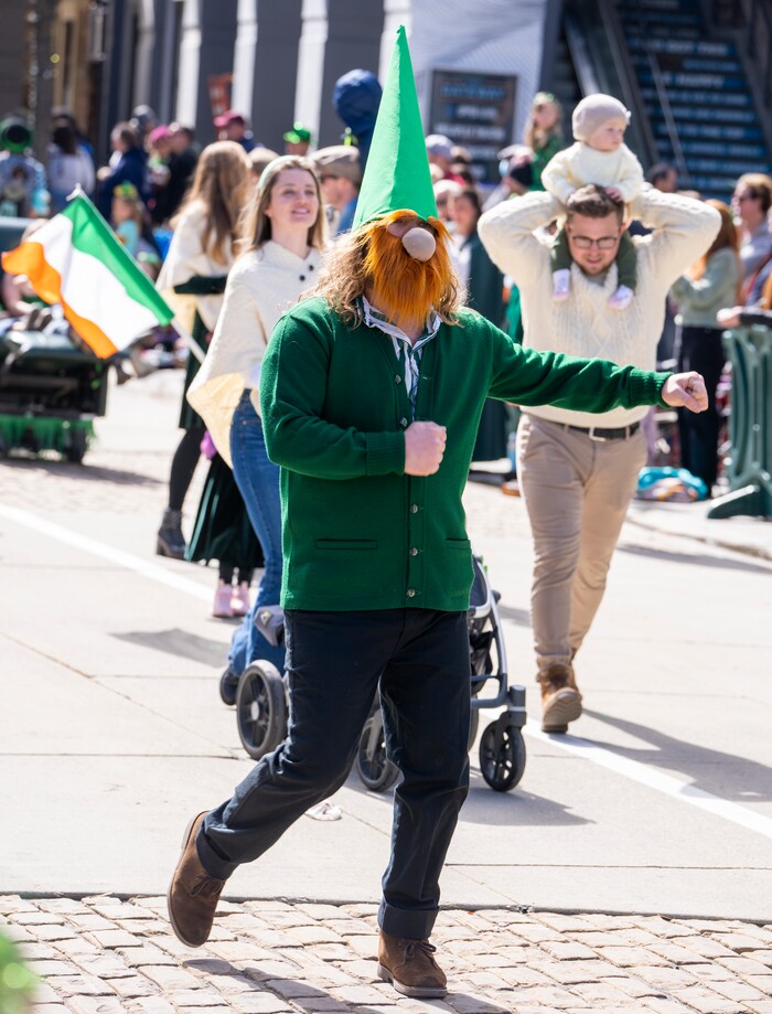 (Rick Egan | The Salt Lake Tribune) A dancing leprechaun in the Saint Patrick's Day Parade at the Gateway on Saturday, March 11, 2023.