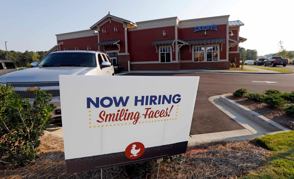 (AP Photo | Rogelio V. Solis) This July 25, 2018, file photo shows a help wanted sign at a new Zaxby's restaurant in Madison, Miss. On Tuesday, Nov. 6, 2018, the Labor Department reports on job openings and labor turnover for September.