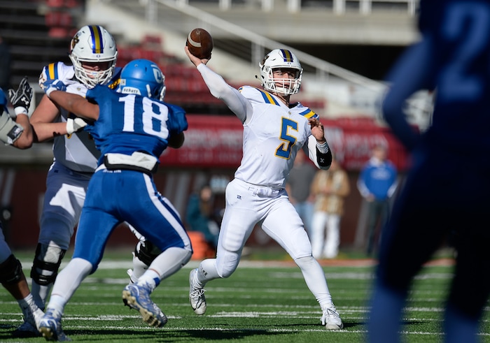 (Francisco Kjolseth  |  The Salt Lake Tribune)  Orem's Cooper Legas spots his man over Dixie in the 4A high school championship game at Rice Eccles Stadium in Salt Lake City, Friday, Nov. 16, 2018.