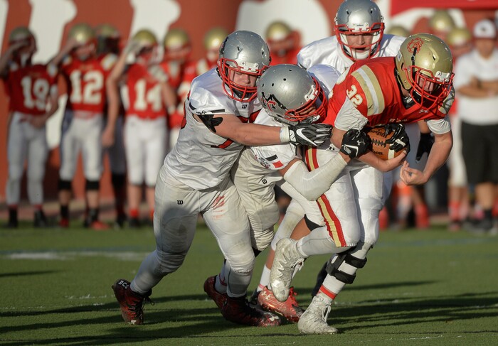 (Francisco Kjolseth  |  The Salt Lake Tribune)  Judge quarterback Parker Edgington manages a few yards before being taken down by the Manti defense in the Class 3A football playoff game on Thursday, Oct. 19, 2017. 