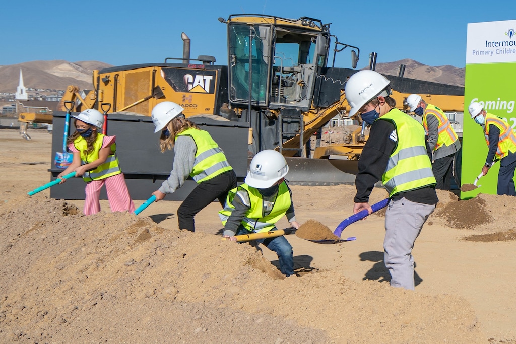 (Photo courtesy of Intermountain Healthcare) Former patients at Primary Children's Hospital — from left: Brailey Partida, Indi Tidwell, Aiden Tilley and Payson Inkley — dig into dirt at the future site of the new Primary Children's Hospital site in Lehi, on Nov. 19, 2020. The hospital, a companion to Primary Children's Hospital in Salt Lake City, is expected to open in early 2024.