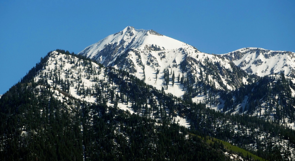 (Rick Bowmer | AP file photo) This June 10, 2019, photo shows the Wasatch Range near Salt Lake City when the state's snowpack was about 150 percent higher than the historical average. Utah's snowpack has been augmented by an extensive cloud seeding program that's received state funds most years since 1973.