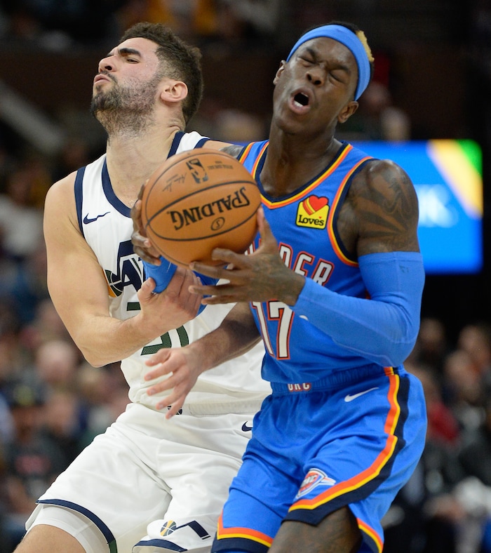 (Francisco Kjolseth  |  The Salt Lake Tribune)  Utah Jazz forward Georges Niang (31) collides with Oklahoma City Thunder guard Dennis Schroder (17) as the Utah Jazz host the Oklahoma City Thunder in their NBA basketball game at Vivint Smart Home Arena in Salt Lake City on Mon. Dec. 9, 2019.