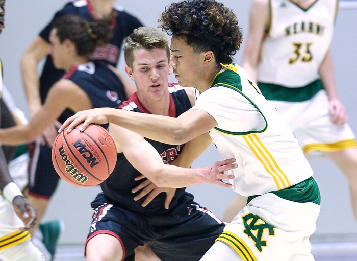 (Leah Hogsten  |  The Salt Lake Tribune) Weber's Brandon Capener (22) fouls Kearns' Nate Maiava (05). Weber defeated Kearns 60-52 in the 6A High School Boys' Basketball Tournament opening game at Weber State University’s Dee Events Center in Ogden, Tuesday, Feb. 27, 2018. 