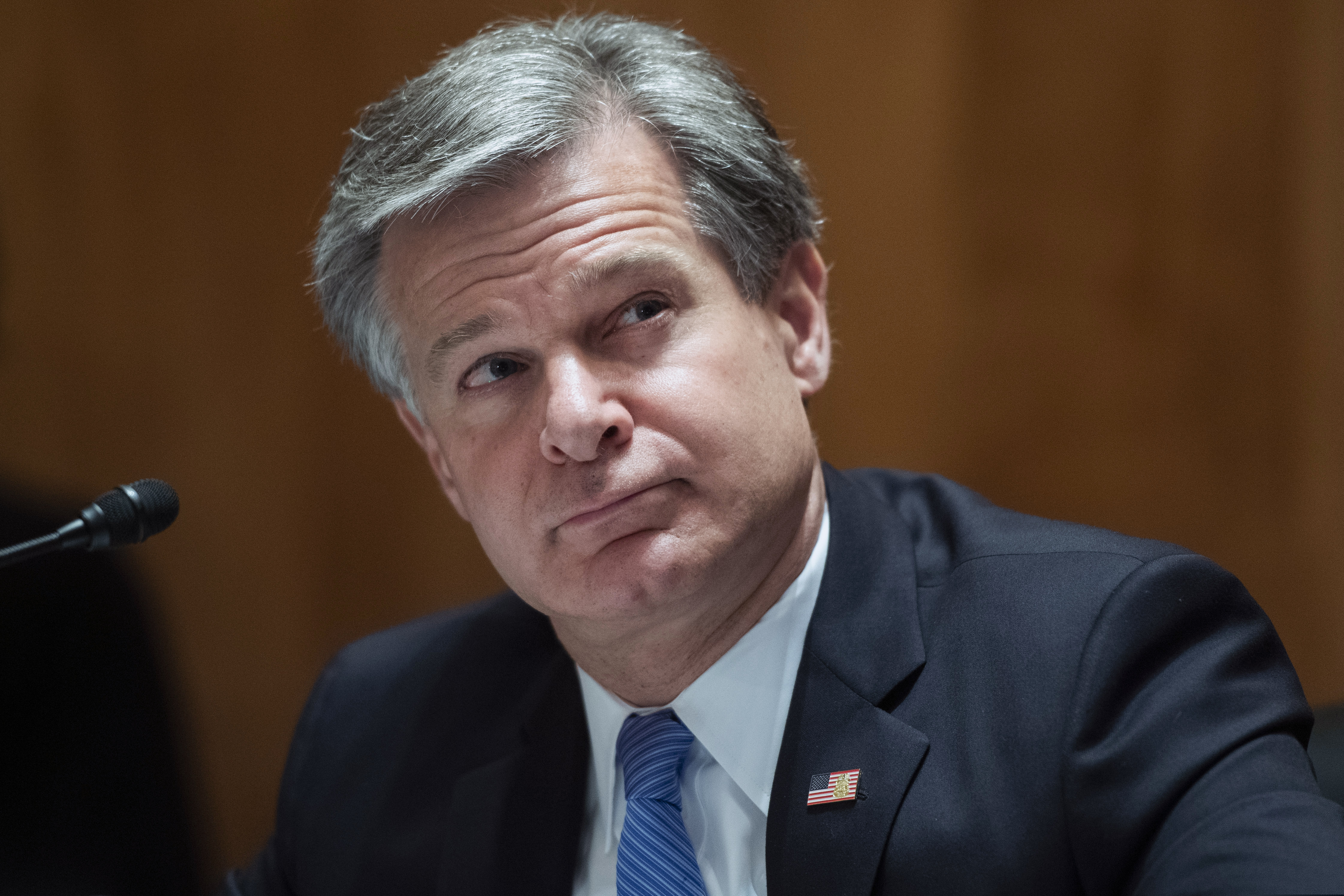 (Tom Williams | Pool via AP)

FBI Director Christopher Wray, testifies during a Senate Homeland Security and Governmental Affairs Committee hearing on "Threats to the Homeland," Sept. 24, 2020 on Capitol Hill in Washington.