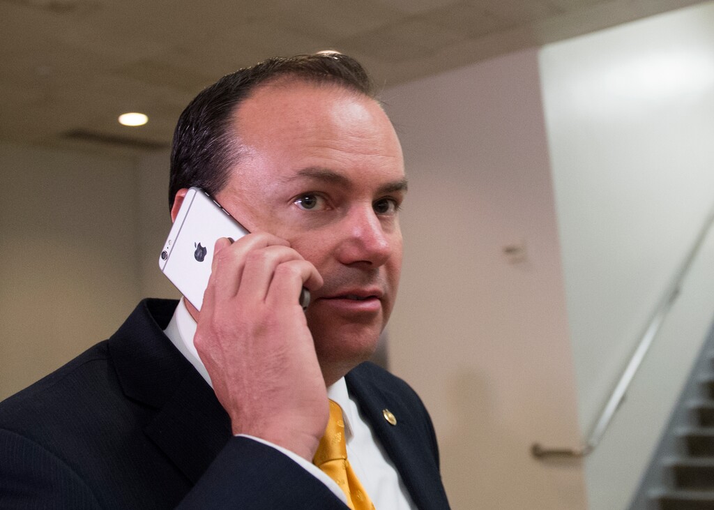 Sen. Mike Lee, R-Utah, walks through the U.S. Capitol on his way to attend a closed briefing for senators on Iran, in Washington, Tuesday, July 22, 2015.  AP Photo/Molly Riley)