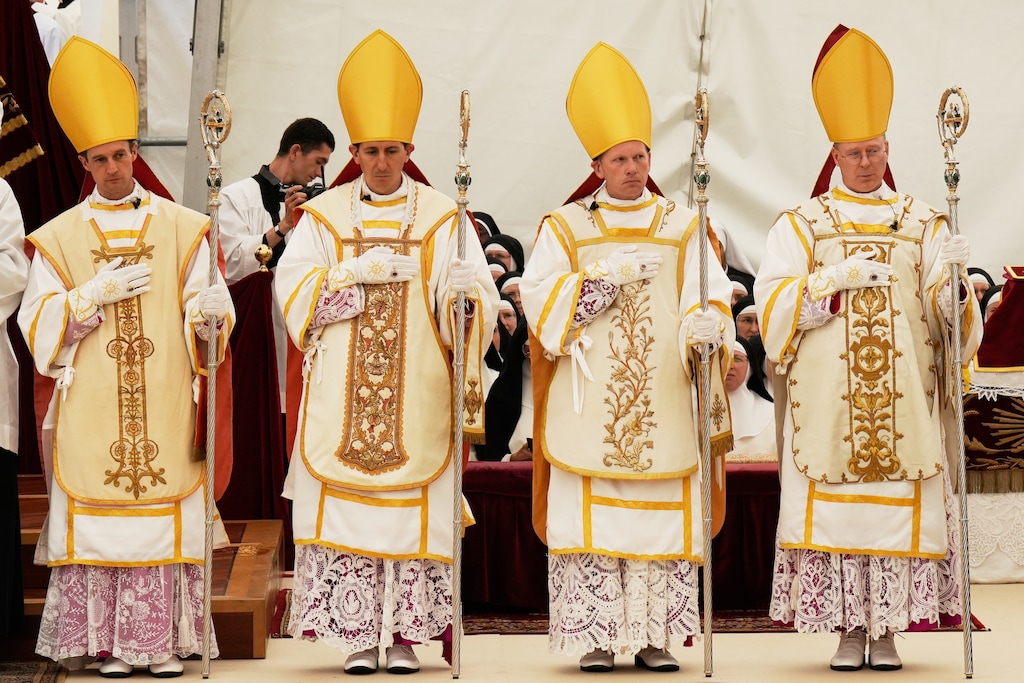 (Baz Ratner | AP) Newly consecrated bishops — Marc Hanappier, left, Michel Poinsinet de Sivry, Michael Goldade and Pascal Schreiber — by the Society of St. Pius X, in defiance of the Vatican, in Écône, Switzerland, on Wednesday, July 1, 2026.