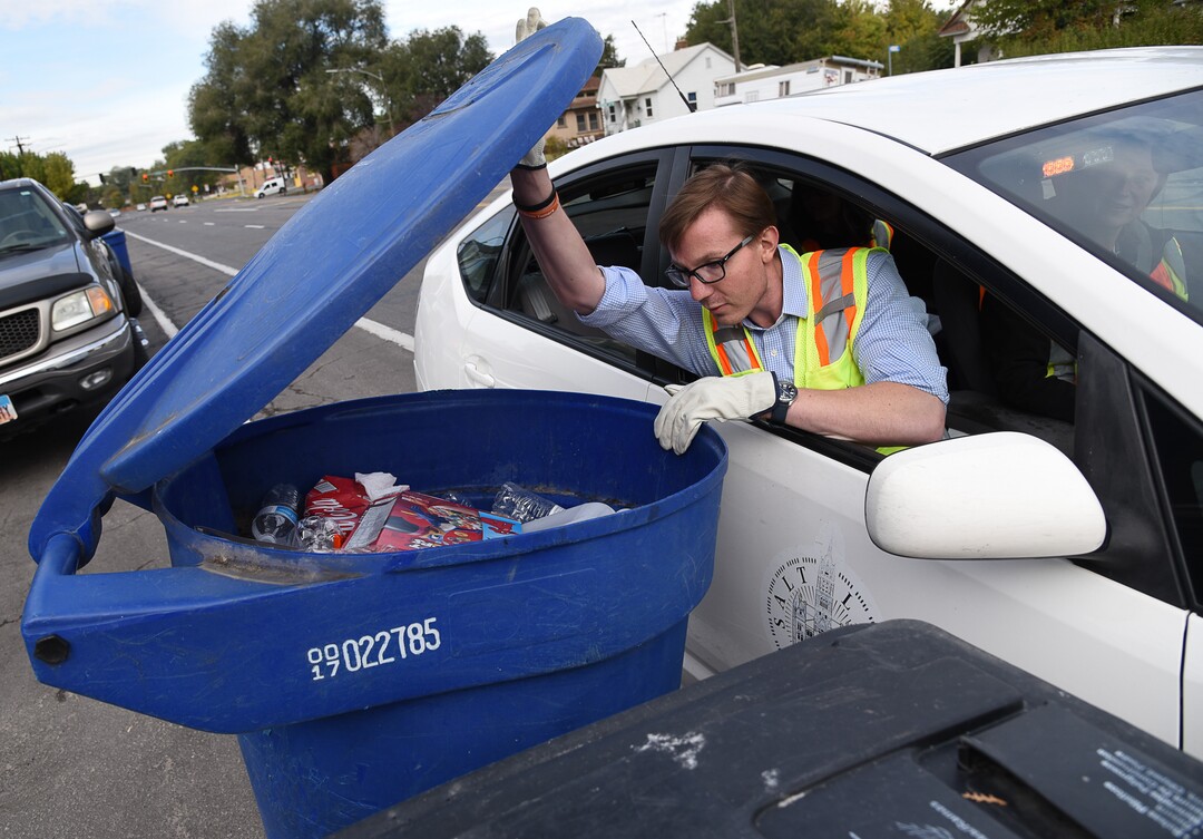(Francisco Kjolseth  |  The Salt Lake Tribune)  David Johnston, permits coordinator for Salt Lake City Corporation Sanitation Division checks on people's recycling bins in an effort to reduce waste problems in the recycling stream. One of the primary changes in the last year is the recycling program no longer takes styrofoam or plastic bags, including plastic bags that might be used to hold peoples recyclables. 
