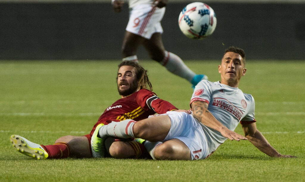 Rick Egan  |  The Salt Lake TribuneReal Salt Lake midfielder Kyle Beckerman (5) gets tangled up with Atlanta United midfielder Carlos Carmona (14), in Real Salt Lake Vs. Atlanta United, at Rio Tinto Stadium, Wednesday, April 22, 2017.