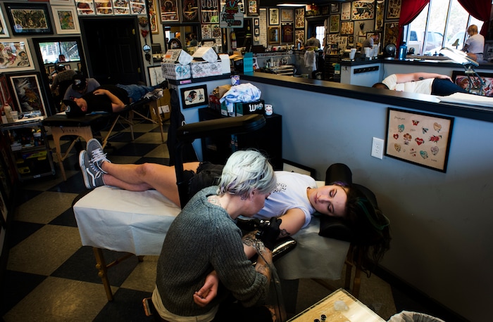 (Rick Egan | The Salt Lake Tribune) Clients get tattoos at the Yellow Rose Tattoo during a flash tattoo event where all proceeds go to the Rape Recovery Center of Utah. It's part of a national event where tattoo shops raise money for sexual assault victims. Sunday, June 10, 2018.