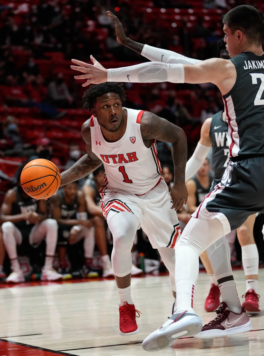 (Francisco Kjolseth | The Salt Lake Tribune) Utah Utes guard David Jenkins Jr. (1) tries to get past Washington State in game action during an NCAA college basketball game at the Jon M.Huntsman Center, on Saturday, Jan. 8, 2022. Utah lost 61-77.