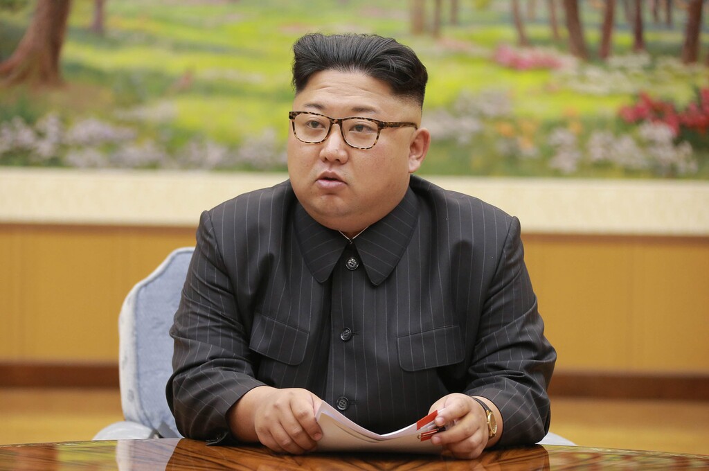 FILE- In this Sept. 3, 2017, image distributed on Sept. 4, 2017, by the North Korean government, North Korea's leader Kim Jong Un holds a meeting of the ruling party's presidium. Kim is calling President Donald Trump "deranged" and says in a statement carried by the state news agency that he will "pay dearly" for his threats. The statement, carried by North's official Korean Central News Agency, responds to Trump's combative speech at the U.N. General Assembly on Tuesday, Sept. 19. (Korean Central News Agency/Korea News Service via AP, File)