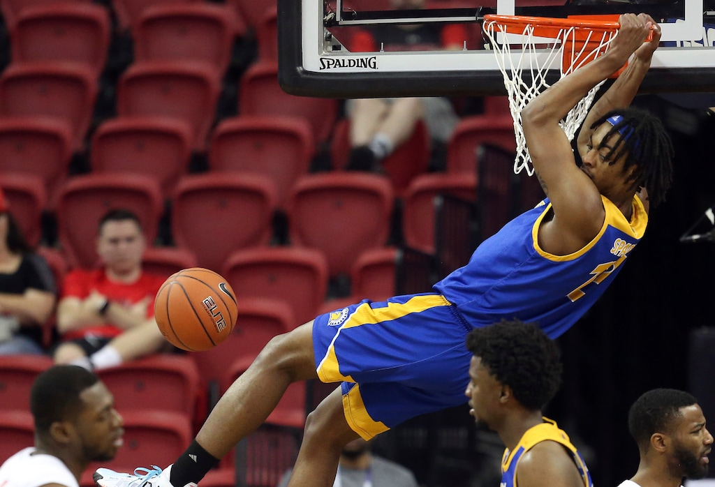 (Isaac Brekken | AP) San Jose State's Seneca Knight dunks during the first half of a Mountain West Conference tournament NCAA college basketball game against New Mexico Wednesday, March 4, 2020, in Las Vegas.