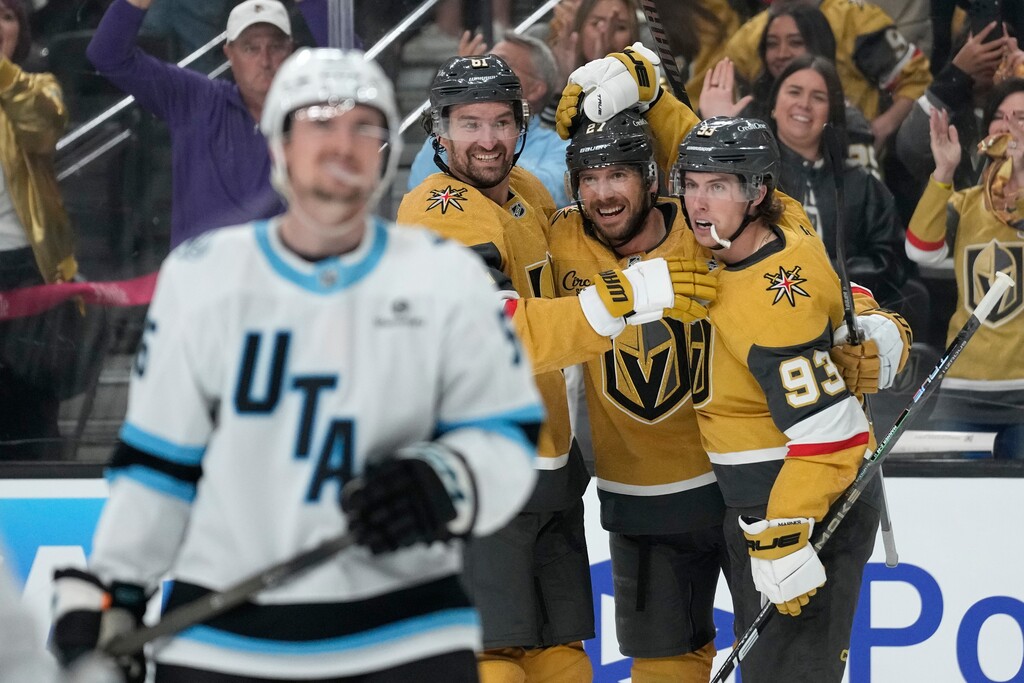 (John Locher | AP) Vegas Golden Knights defenseman Shea Theodore, second from right, celebrates after scoring against the Utah Mammoth during the second period on Wednesday night. Vegas won the game in double overtime.