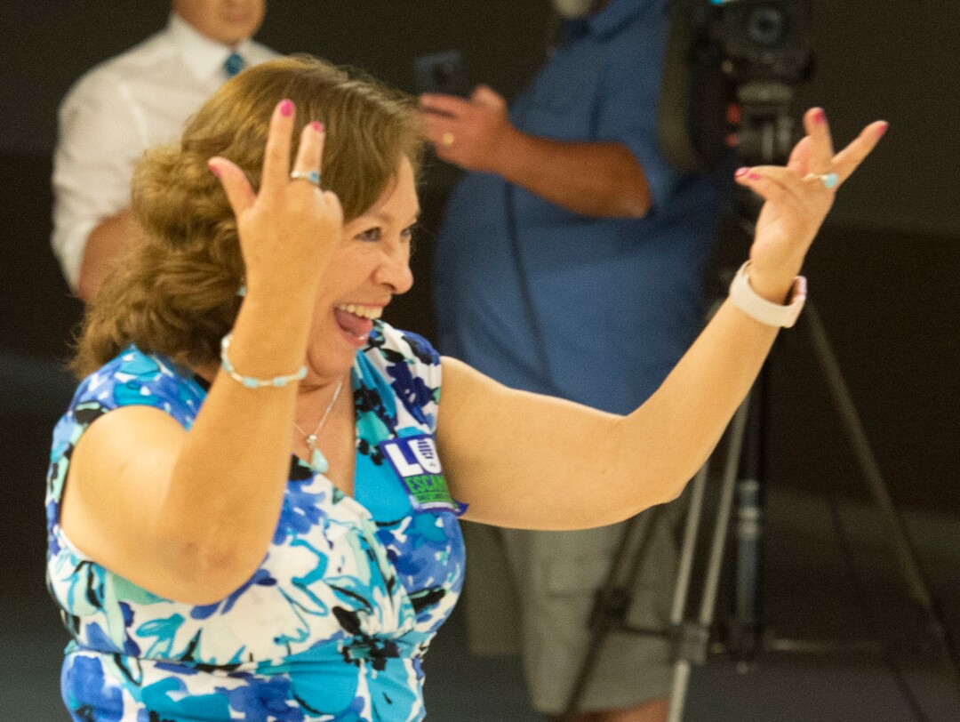 (Rick Egan  |  The Salt Lake Tribune)     Luz De La Rosa mother of Luz Escamilla dances to the music, at the campaign watch party for Luz Escamilla, at the Utah State Fairgrounds, Tuesday, Aug. 13, 2019.