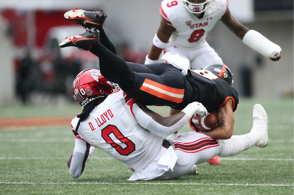 Utah linebacker Devin Lloyd (0) brings down Oregon State wide receiver Trevon Bradford (8) during the first half of an NCAA college football game Saturday, Oct. 23, 2021, in Corvallis, Ore. (AP Photo/Amanda Loman)
