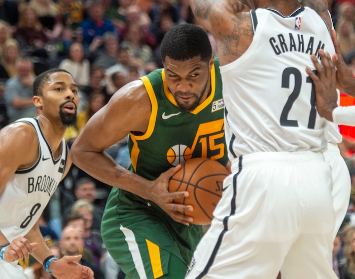 (Rick Egan  |  The Salt Lake Tribune)   Utah Jazz forward Derrick Favors (15) is double-teamed by Brooklyn Nets guard Spencer Dinwiddie (8) and Brooklyn Nets guard Treveon Graham (21), in NBA action between Utah Jazz and Brooklyn Nets at Vivint Smart Home Arena, Saturday, March 16, 2019.


