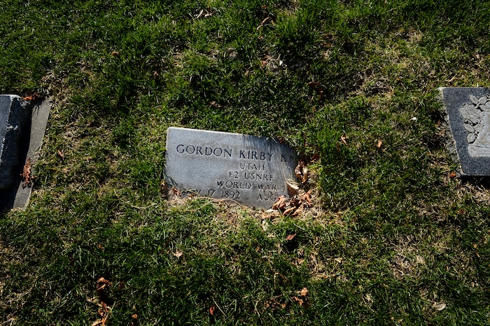(Scott Sommerdorf | The Salt Lake Tribune)
A headstone marking the resting place of a World War One veteran is sinking into the ground at the Salt Lake City Cemetery, Friday, April 13, 2018. The cemetery is historic, beloved by relatives, neighbors, nature and recreation lovers -- and needs about $27 million in repairs, improvements and financial aid. The city is reviewing a master plan to make fixes and improvements. 
