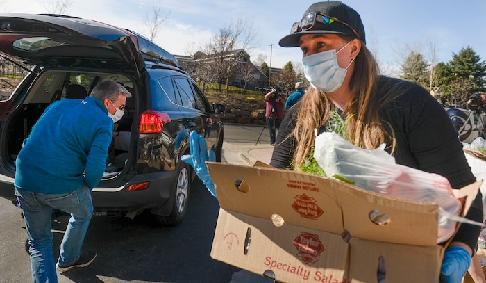 (Leah Hogsten  |  The Salt Lake Tribune)  Snowbird employees handed out over 10,000 pounds of perishable items from the ski resort's restaurants and stores to their workforce, March 21, 2020. The food included milk, eggs, bread, cheeses, every kind of herb, vegetable and fruit, including kumquats and lemon grass, and was given to Snowbird employees on a first-come, first-served basis.