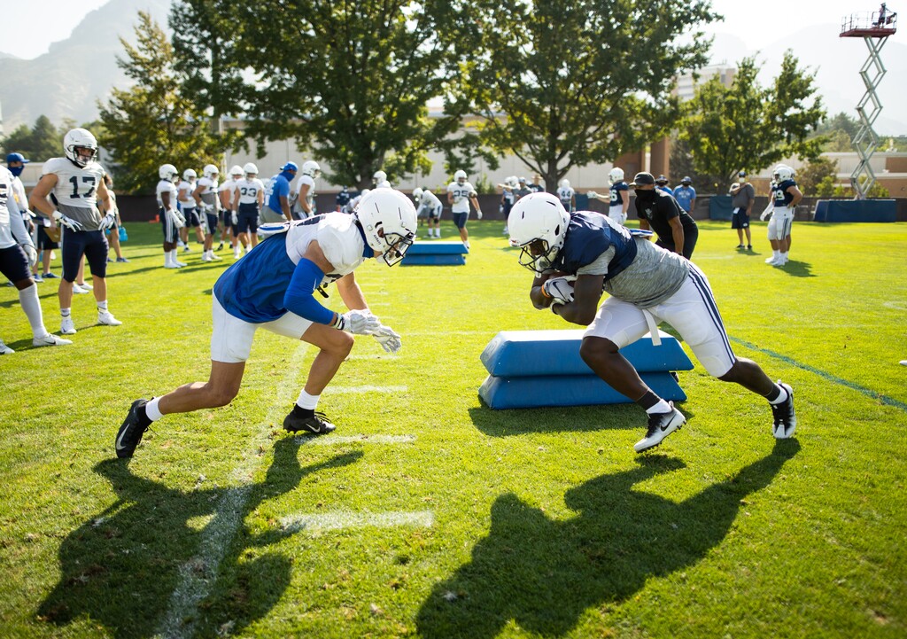 (Jaren Wilkey | BYU) Running back Miles Davis, right, has quickly adapted to his new position and is vying for snaps behind veterans Tyler Allgeier and Lopini Katoa.

© BYU PHOTO 2020
All Rights Reserved
photo@byu.edu  (801)422-7322