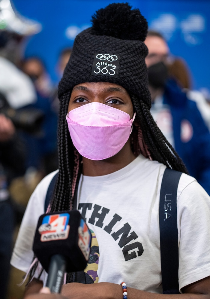 (Rick Egan | The Salt Lake Tribune) Short track speed skater Maame Biney, talks to reporters, as she arrives home at the Salt Lake City International airport, on Monday, Feb. 21, 2022.  